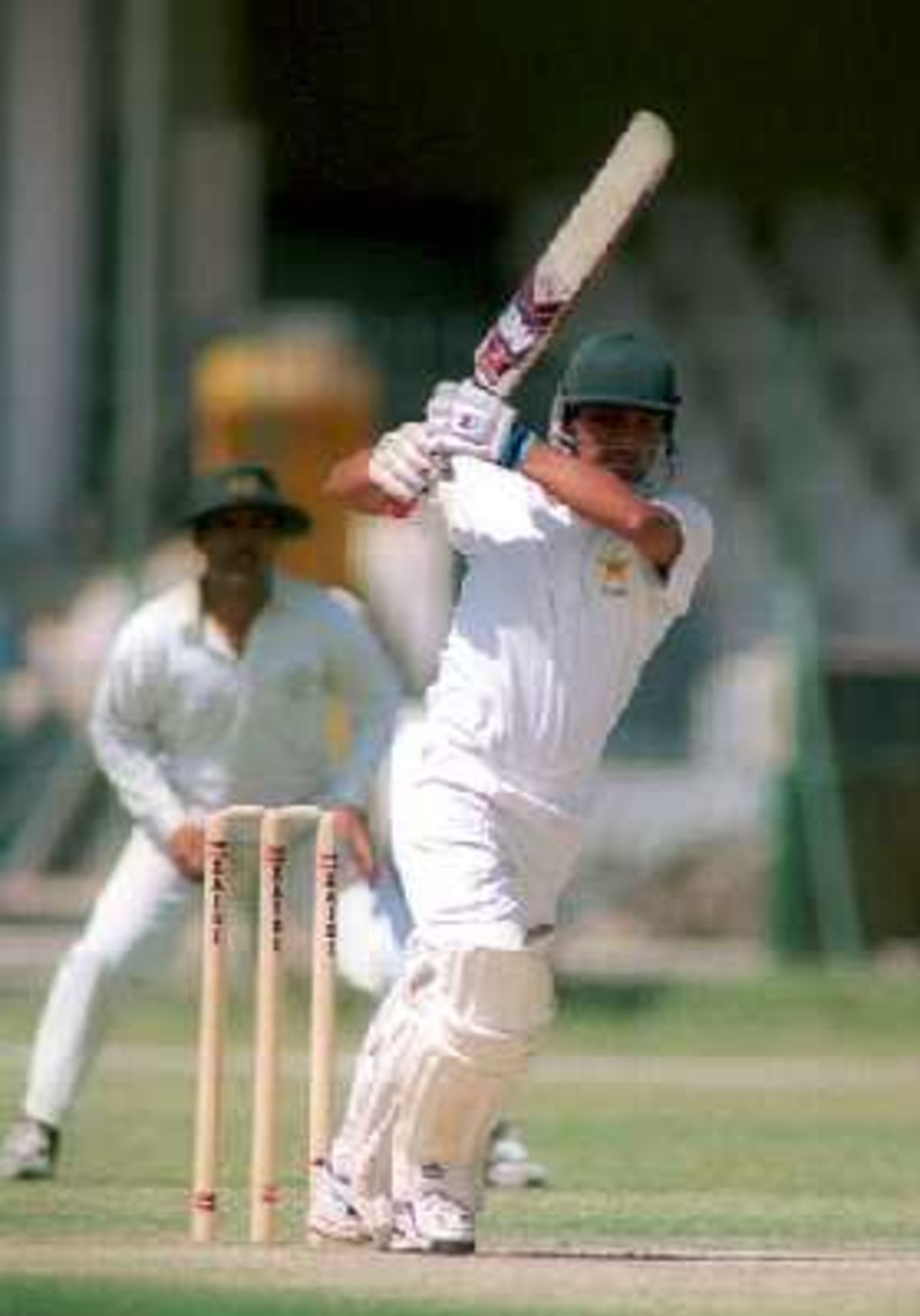 HBL's Imran Farhat plays an on-drive against National Bank at the Gaddafi Staium, Lahore. 6 April 2000.