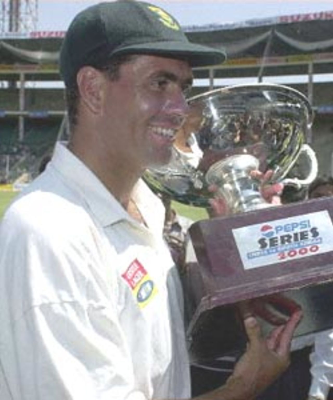 (FILES) Picture dated 06 March 2000 shows South African skipper Hansie Cronje posing with the trophy after South Africa beat India in the second test by an inning and 71 runs to take the Pepsi series 2-0 and end India's 13 year unbeaten home record. New Delhi police have registered charges against skipper Gronje and other members of his team for match fixing during the recent one-day series with India, a highly placed police source said 07 April 2000.