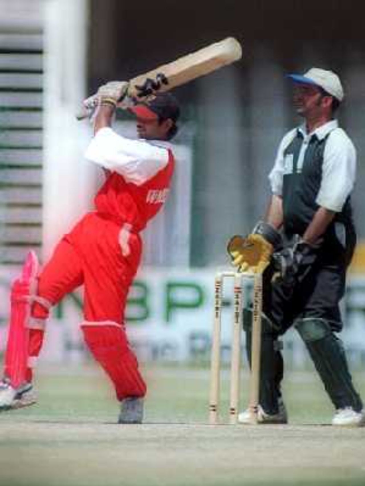 Wapda's Adil Nisar lifts one over mid-wicket against during the 1st semi-final of the NBP Cup against KRL at the Gaddafi Stadium, Lahore. 9 April 2000.