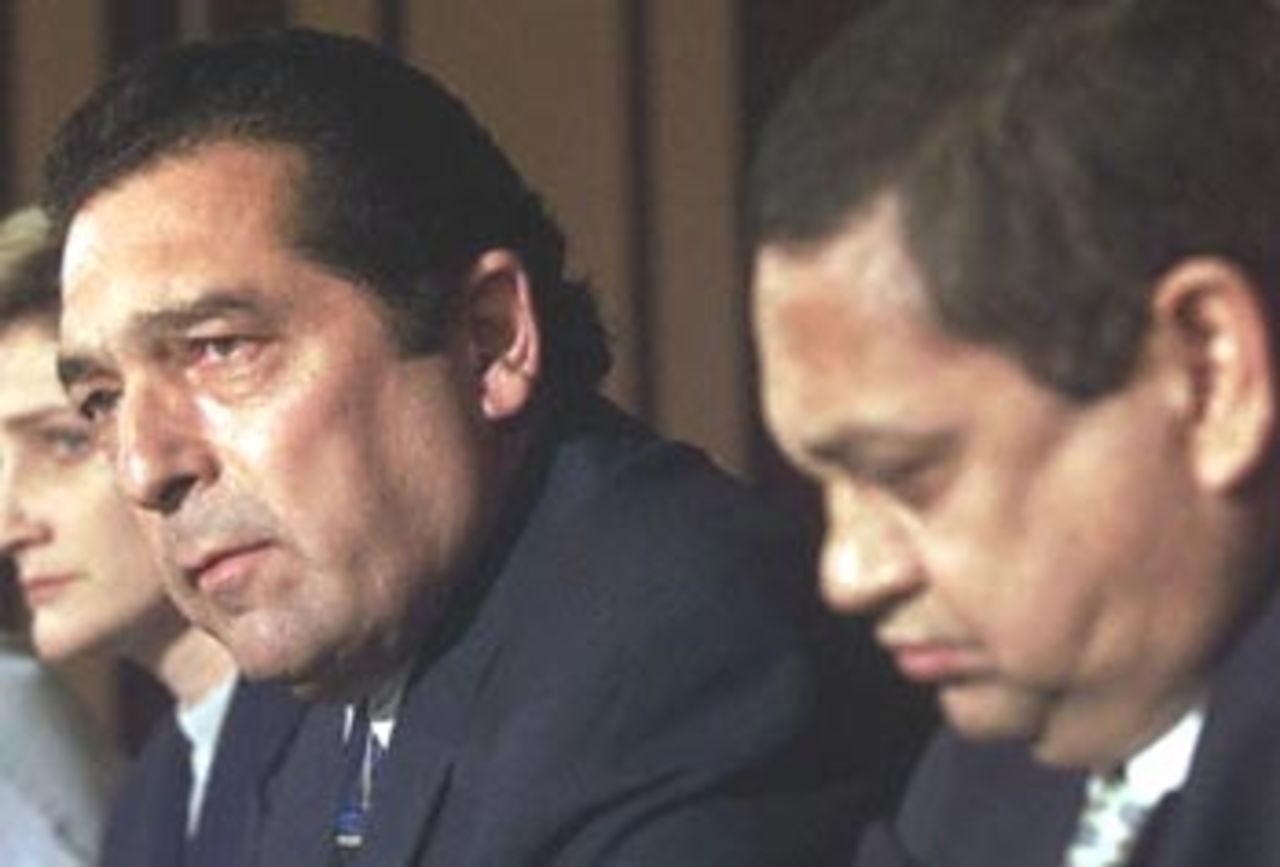 The managing director of the South African United Cricket Board (UCB), Ali Bacher (R), and UCB President Percy Sonn give a press conference 11 April 2000 in Durban. South African cricket captain Hansie Cronje has been suspended after being implicated in a match-fixing scam.