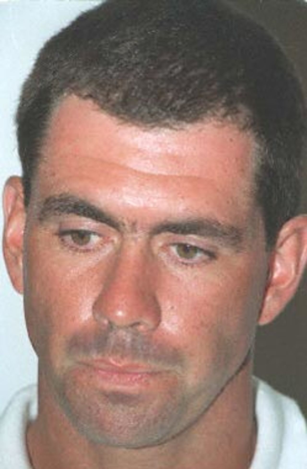South African cricketer Hansie Cronje looks dejected at a press conference held in Cape Town 11 April 2000. Cronje has denied receiving money for match-fixing. He has withdrawn from the upcoming one-day tests against Australia due to be played in South Africa this week and has been stripped of his captaincy of the South African national cricket team.