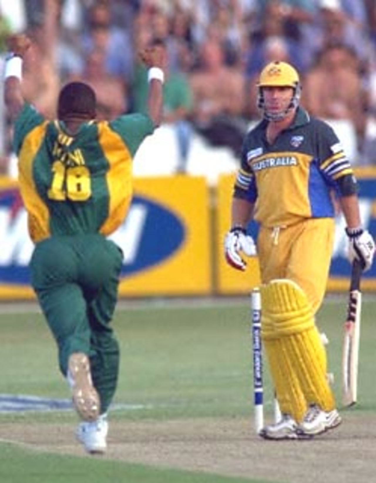 South African bowler Makhaya Ntini (L) celebrates the dismissal of Australian batsman Shane Warne for a duck during a ODI match at the Kingsmead oval in Durban, 12 April 2000.Ntini has taken four wickets as the first three one day match series got under way and South Africa is currently 165 for 7.