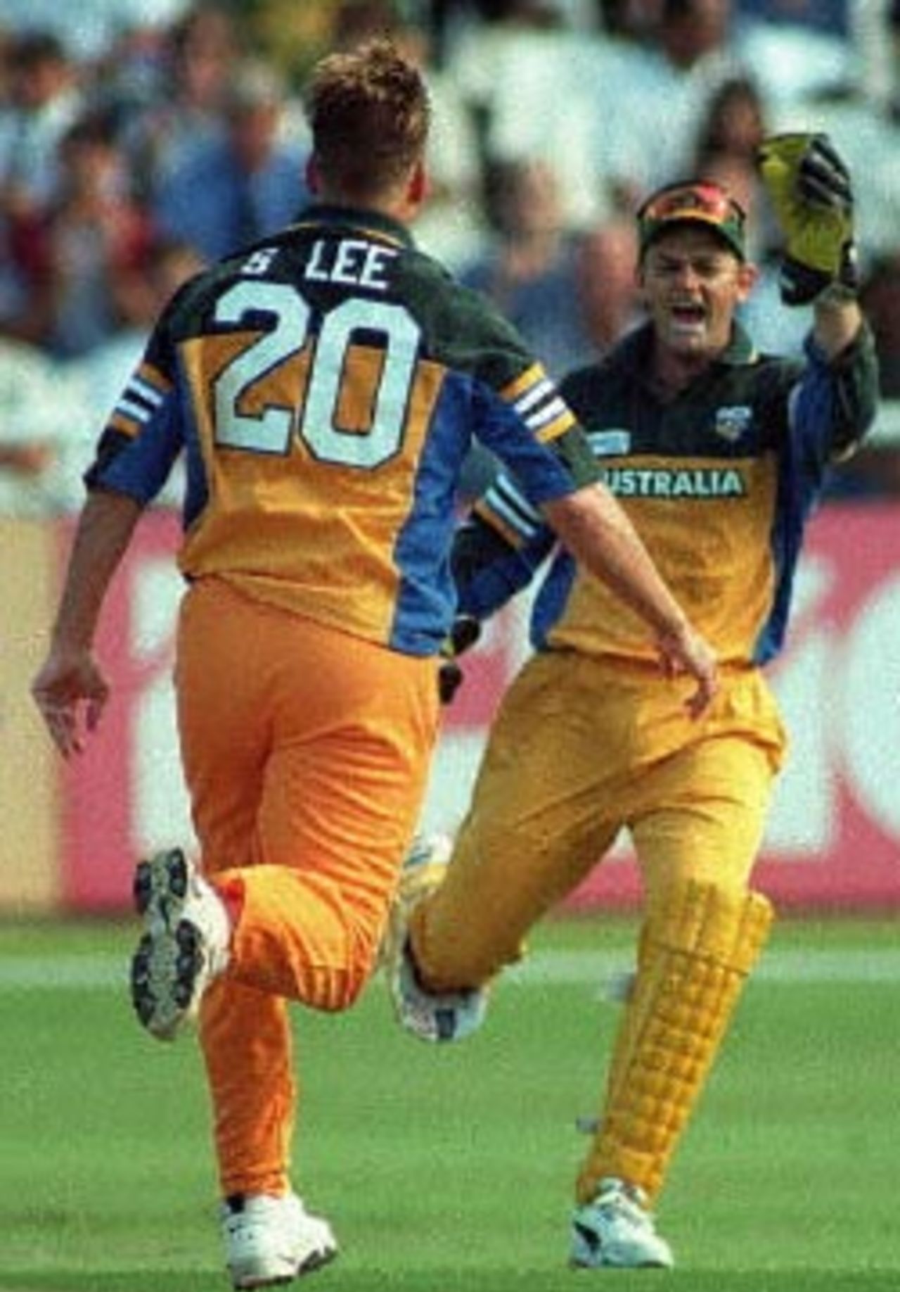 Australian cricketers Shane Lee and wicket-keeper Adam Gilchrist (R) celebrate the fall of yet another South African wicket during the limited overs international played at Newlands in Cape Town 14 April 2000. Adam Gilchrist held a world record six catches as South Africa slumped in the second limited overs international against Australia. Australia won the match by 5 wickets.