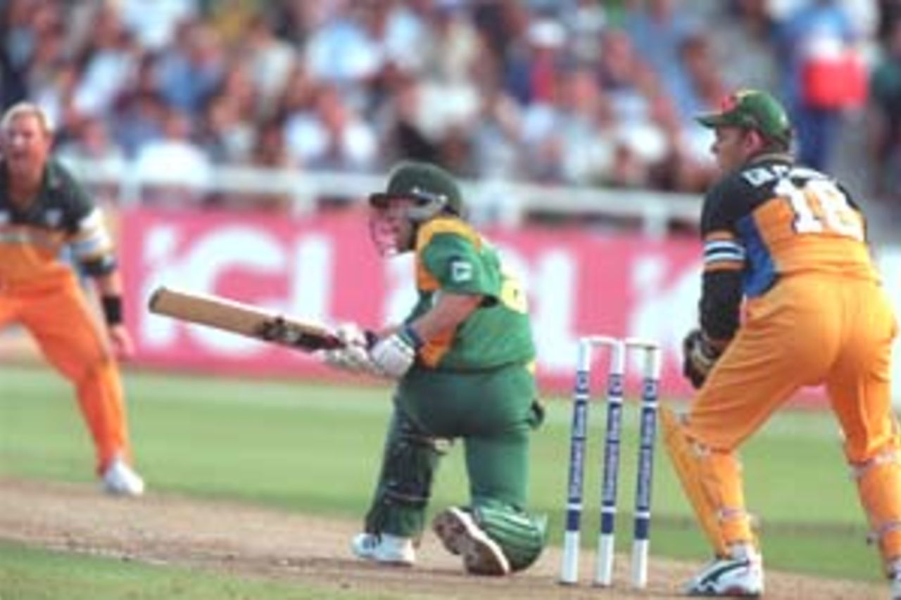 14 Apr 2000: Jonty Rhodes of South Africa sweeps Shane Warne of Australia round the corner during the 3 match series of South Africa v Australia at Newlands, Cape Town, South Africa.
