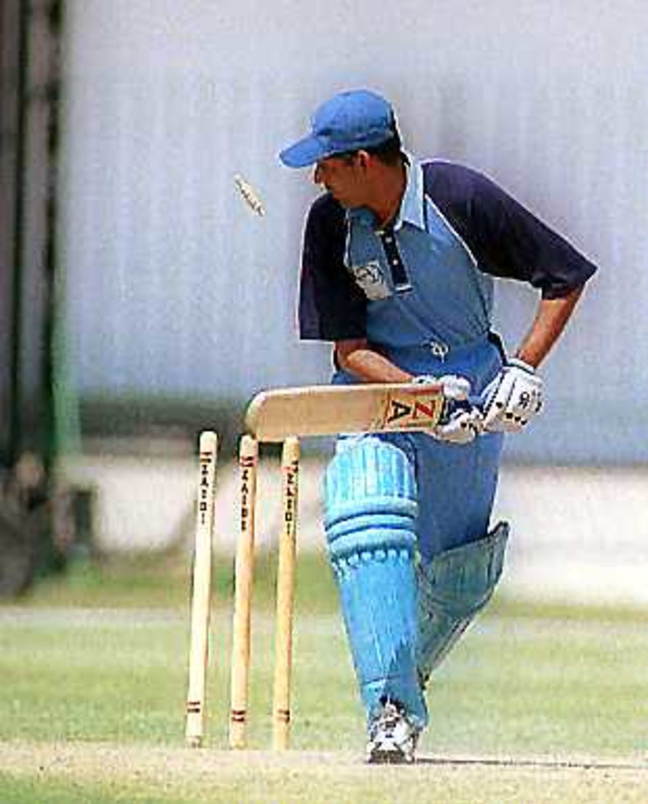 Nadeem Iqbal is bowled by Kabir Khan, Gaddafi Stadium Lahore. 10 April 2000.