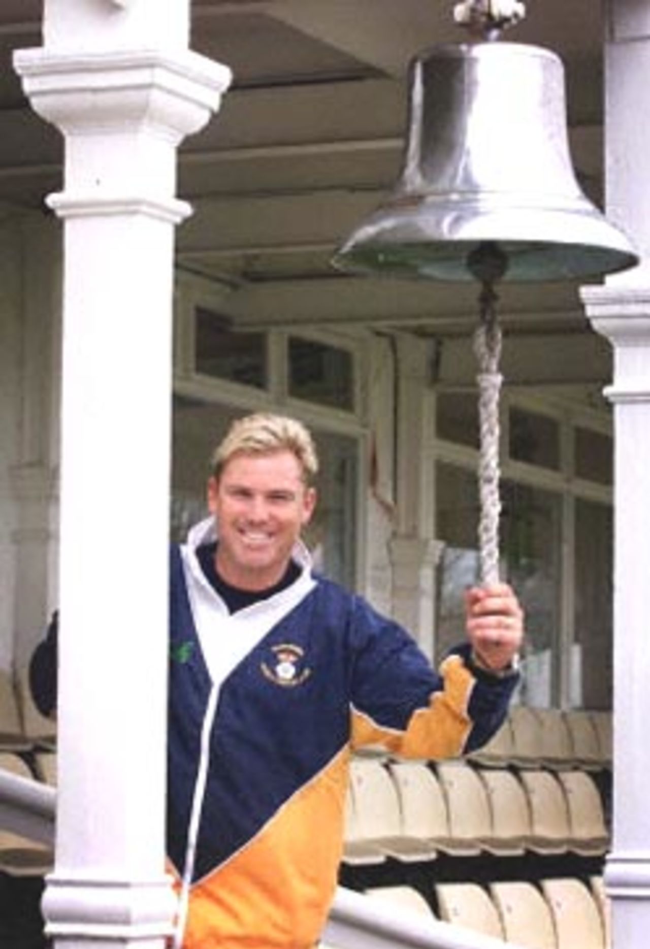 Australia's Shane Warne holds on to the bell at Hampshire's County Ground in Southampton 18 April. Warne signed for Hampshire Cricket Club and makes his debut against Essex Wednesday in the English County Championship.