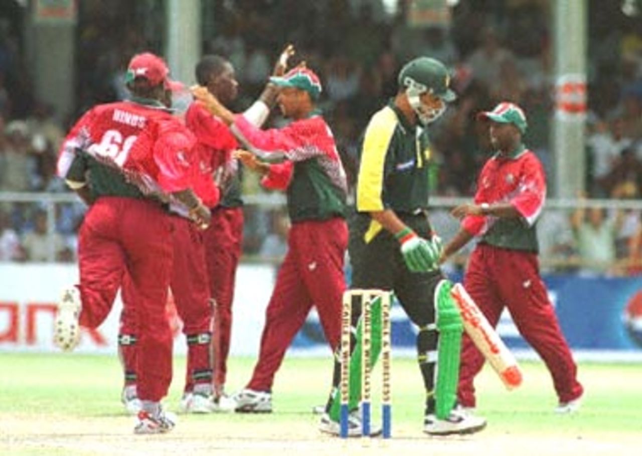 Pakistani batsman Waqar Younis is caught by West Indies wicket keeper Ridley Jacobs 19 April 2000, bowled Chris Gayle at the First Cable & Wireless One Day International Fianl at Kensington Oval, Barbados.
