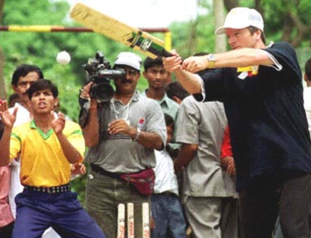 Steve Waugh, the Australian skipper, plays cricket with the local school boys at Udayan, a home children in Barrackpore 20 April 2000. Steve Waugh came here to open a new girls wing at Udayan, which is a home for destitute children of the leprosy patients. He has extended his support for the home since couple of years.