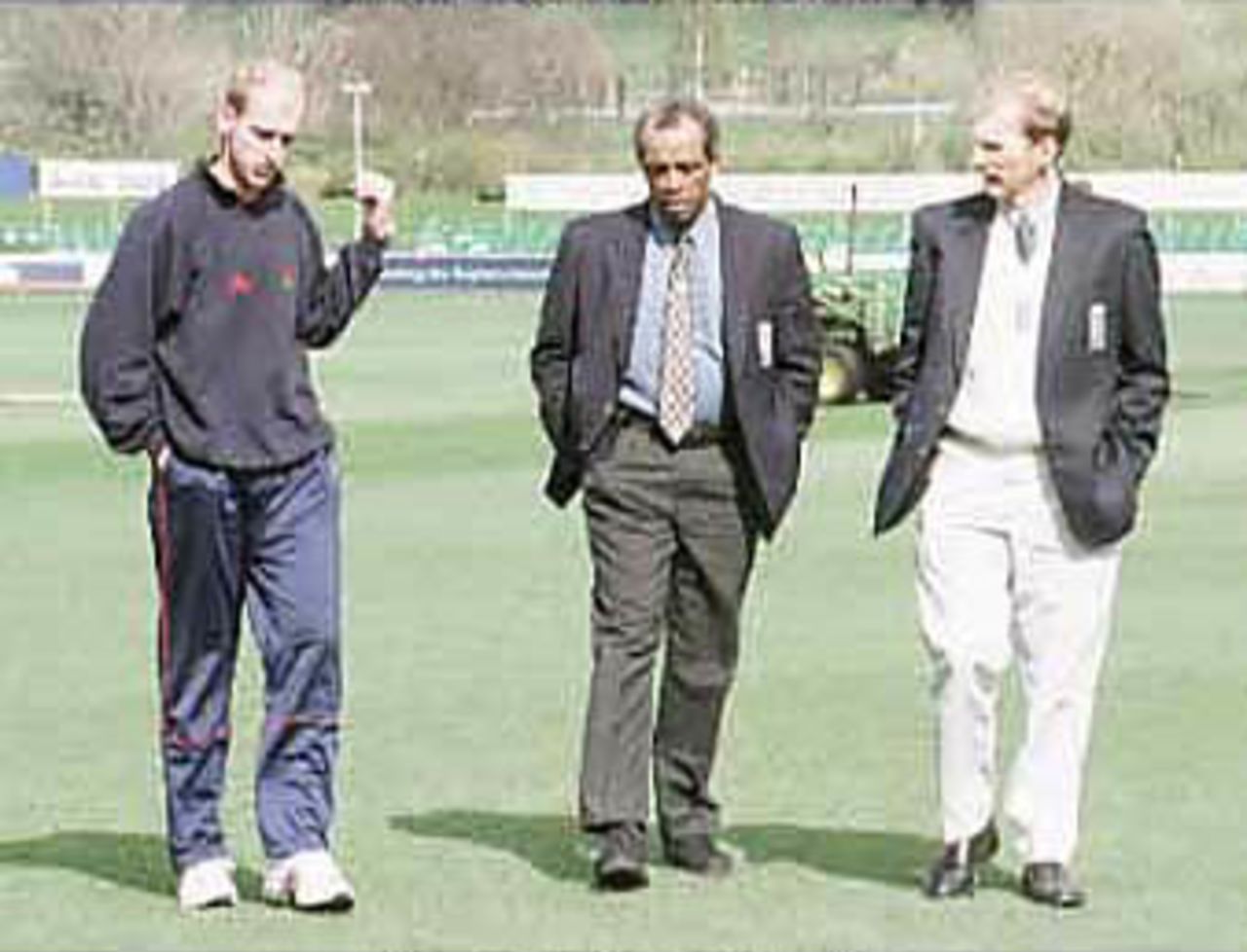 John Crawley discusses the state of the ground with umpires Holder & Mallender, Durham v Lancashire, Benson& Hedges, 20 April 2000
