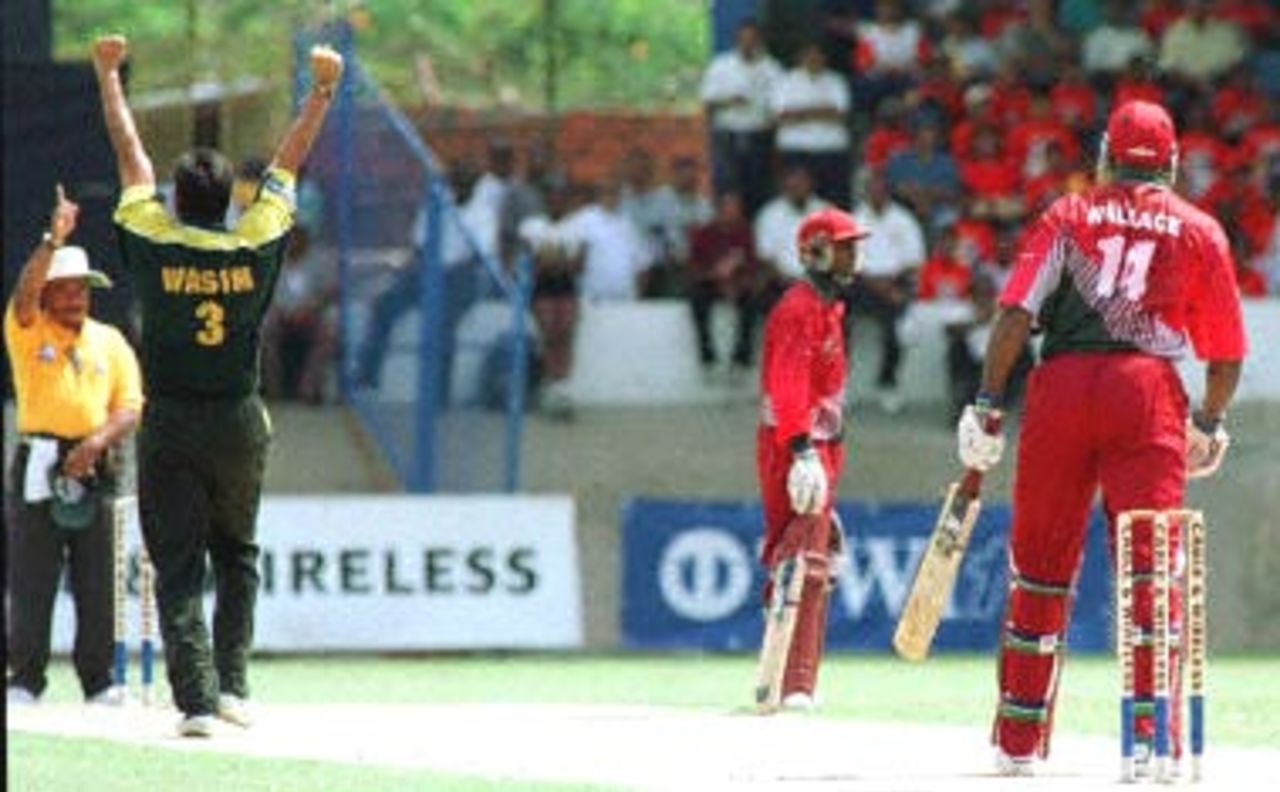 West Indies opening batsman Philo Wallace is LBW by Pakistani bowler Wasim Akram during the Cable and Wireless Pakistan v West Indies second one day final 22 April, 2000, at Queens Park Oval, Trinidad.