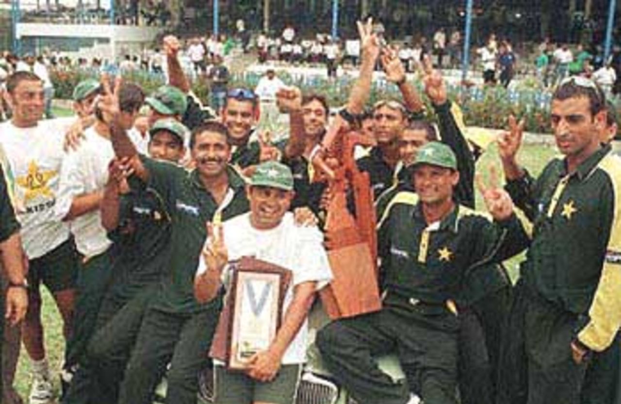 The Pakistani cricket team celebrates after beating the West Indies team at Queens Park Oval in Port of Spain, Trinidad and Tobago. Pakistani bowlers led by Mushtaq Ahmed and their batsmen formalized a four-wicket victory against the West Indies. Third final, Cable and Wireless Series, 23rd April 2000.