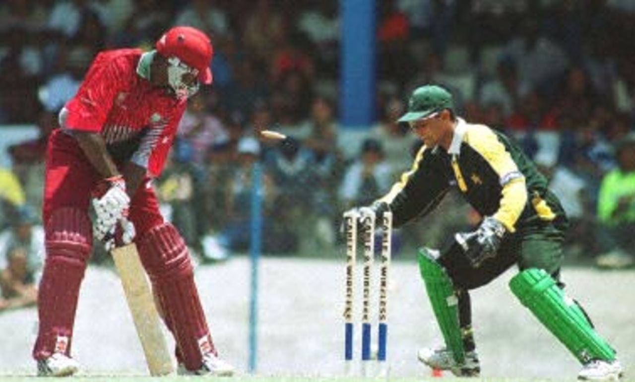 West Indies Batsman Wavell Hinds (L) is bowled by Pakistani Mushtaq Ahmed during their match in Port of Spain, Trinidad and Tobago. Third final, Cable and Wireless Series 23rd April 2000.