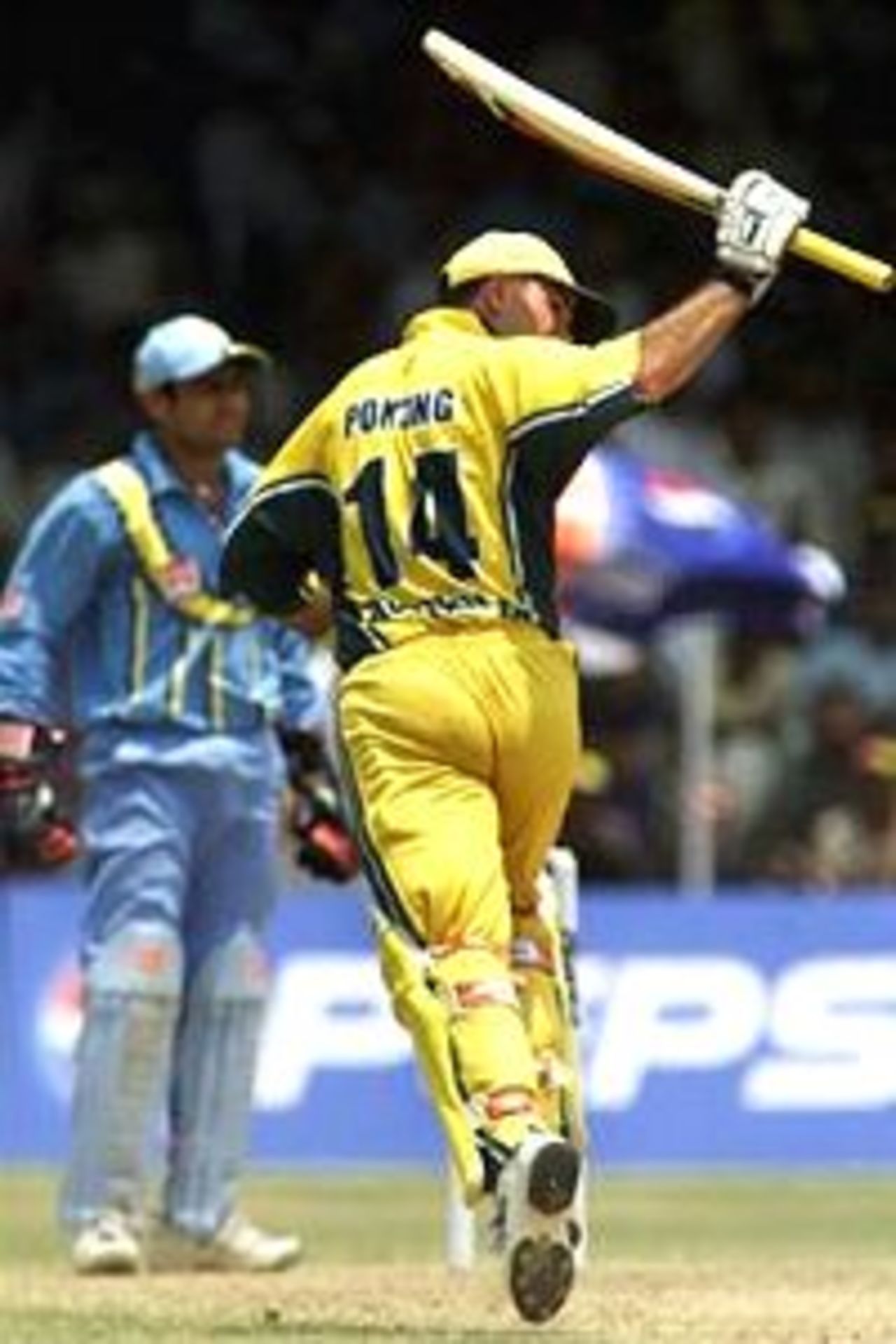 Ricky Ponting of Australia begins to celebrate his century as he completes his 100th run, during the fourth One Day International between India and Australia played at the Municipal Corporation Stadium, Vizag, India.
