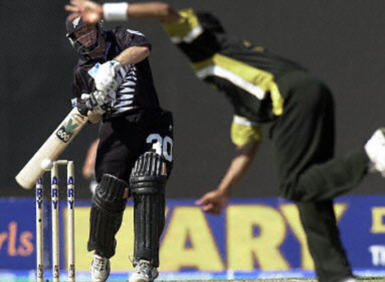 Chris Nevin tries to loft a ball off Mohammad Sami, ODI 3 at Sharjah, New Zealand v Pakistan, 12 April 2001