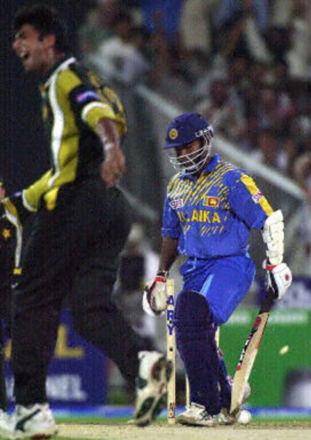 New fast bowler Kashif Raza celebrates his first ODI wicket after bowling Kaluwitharana, ODI 4 at Sharjah, Pakistan v Sri Lanka, 13 April 2001