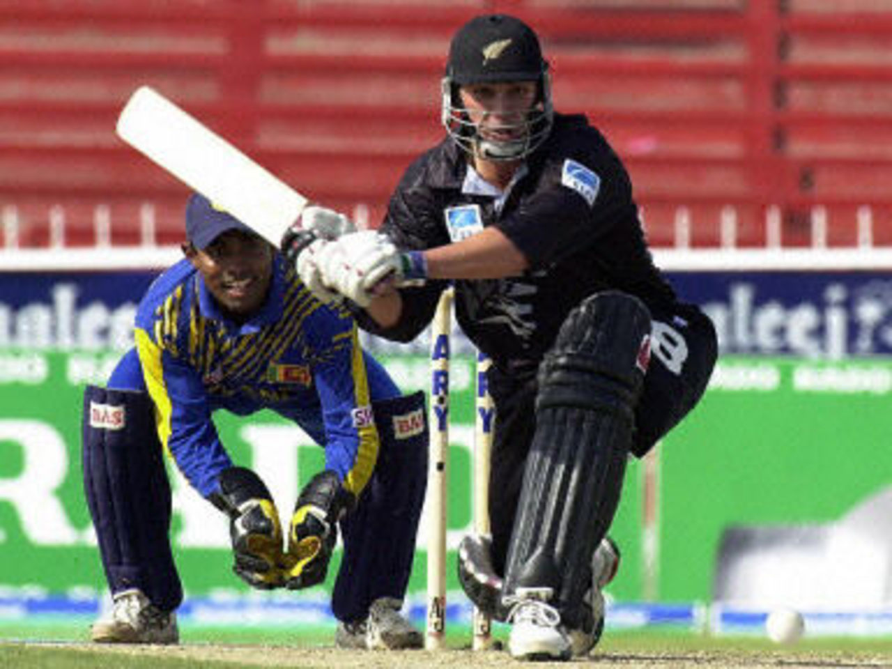 Mathew Sinclair sweeps for a boundary, ODI6 at Sharjah, New Zealand v Sri Lanka, 17 April 2001
