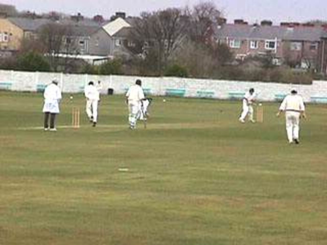 Shaun Young bowls the first ball of the season to Liam Jackson