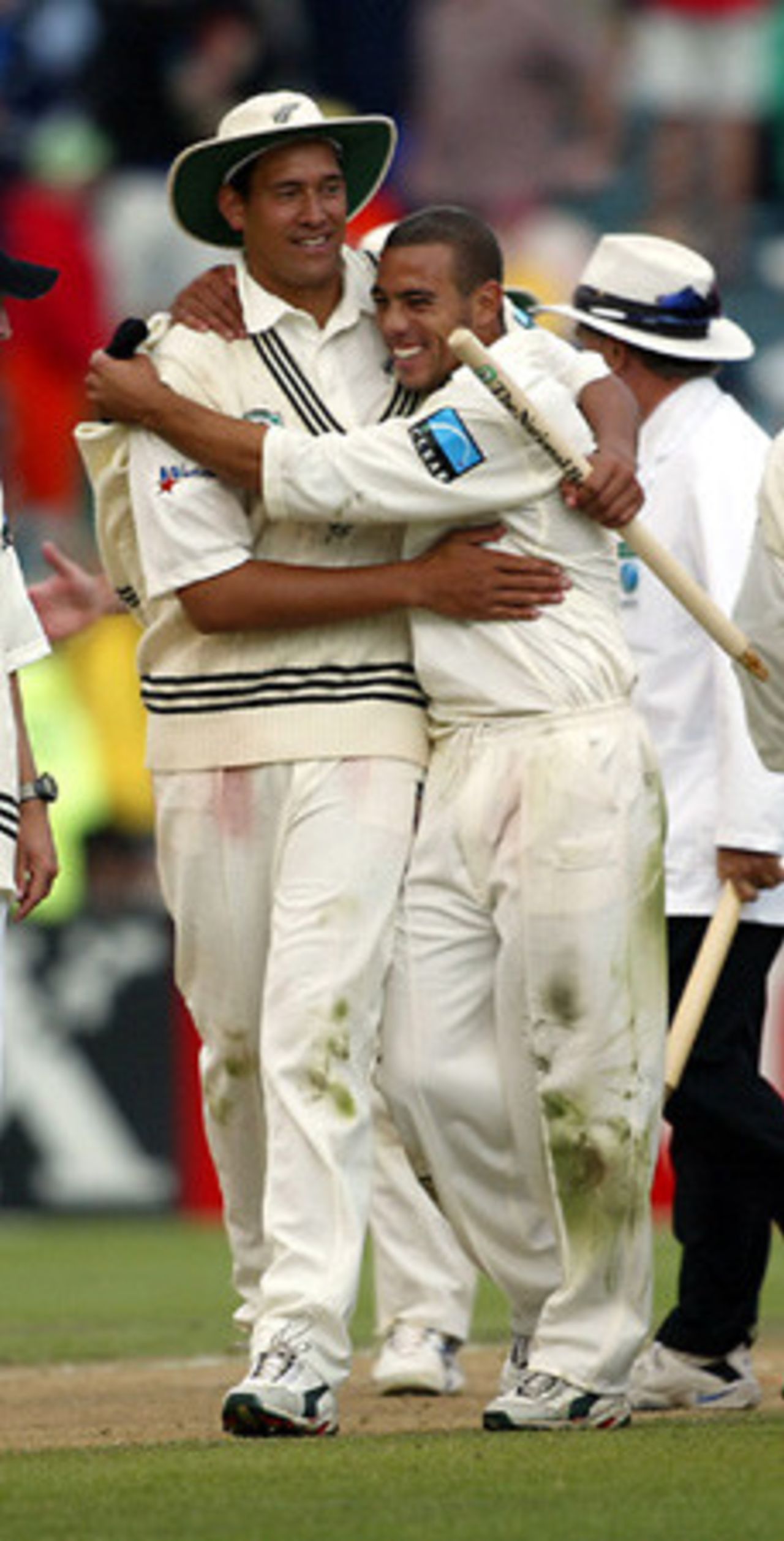 New Zealand player Daryl Tuffey (left) is hugged by team-mate Andre Adams as New Zealand win the match, beating England by 78 runs to draw the 3-Test series 1-1. 3rd Test: New Zealand v England at Eden Park, Auckland, 30 March-3 April 2002 (3 April 2002).