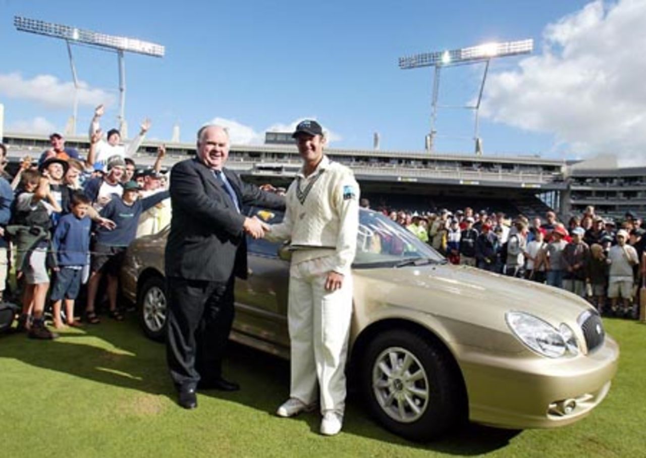 New Zealand player Nathan Astle is congratulated by Hyundai New Zealand chairman Colin Giltrap upon winning The National Bank International Cricketer of the Year award. Astle won a Hyundai Sonata motor vehicle valued at $32,000. 3rd Test: New Zealand v England at Eden Park, Auckland, 30 March-3 April 2002 (3 April 2002).