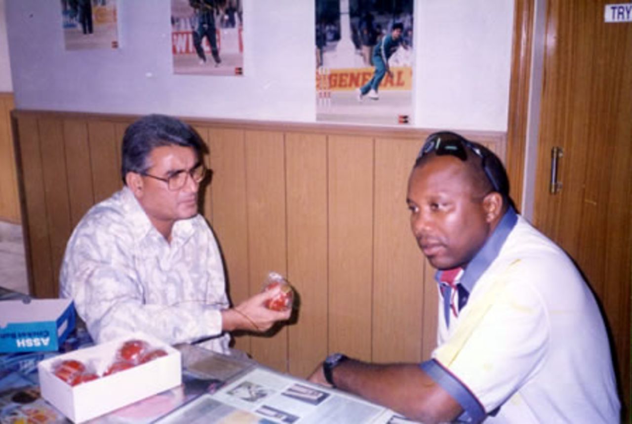 Malcolm Marshall and Azhar Zaidi discussing cricket balls at Zaidi Sports - during the West Indies tour to Pakistan, 1997-98
