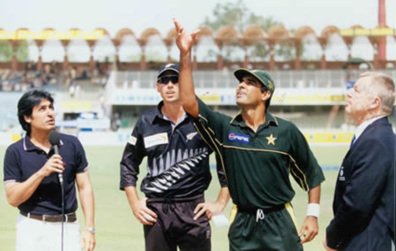 Waqar Younis tosses the coin watched by Stephen Fleming, Rameez Raja and Referee Mike Procter - 3rd ODI at Lahore, New Zealand v Pakistan, 27 Apr 2002