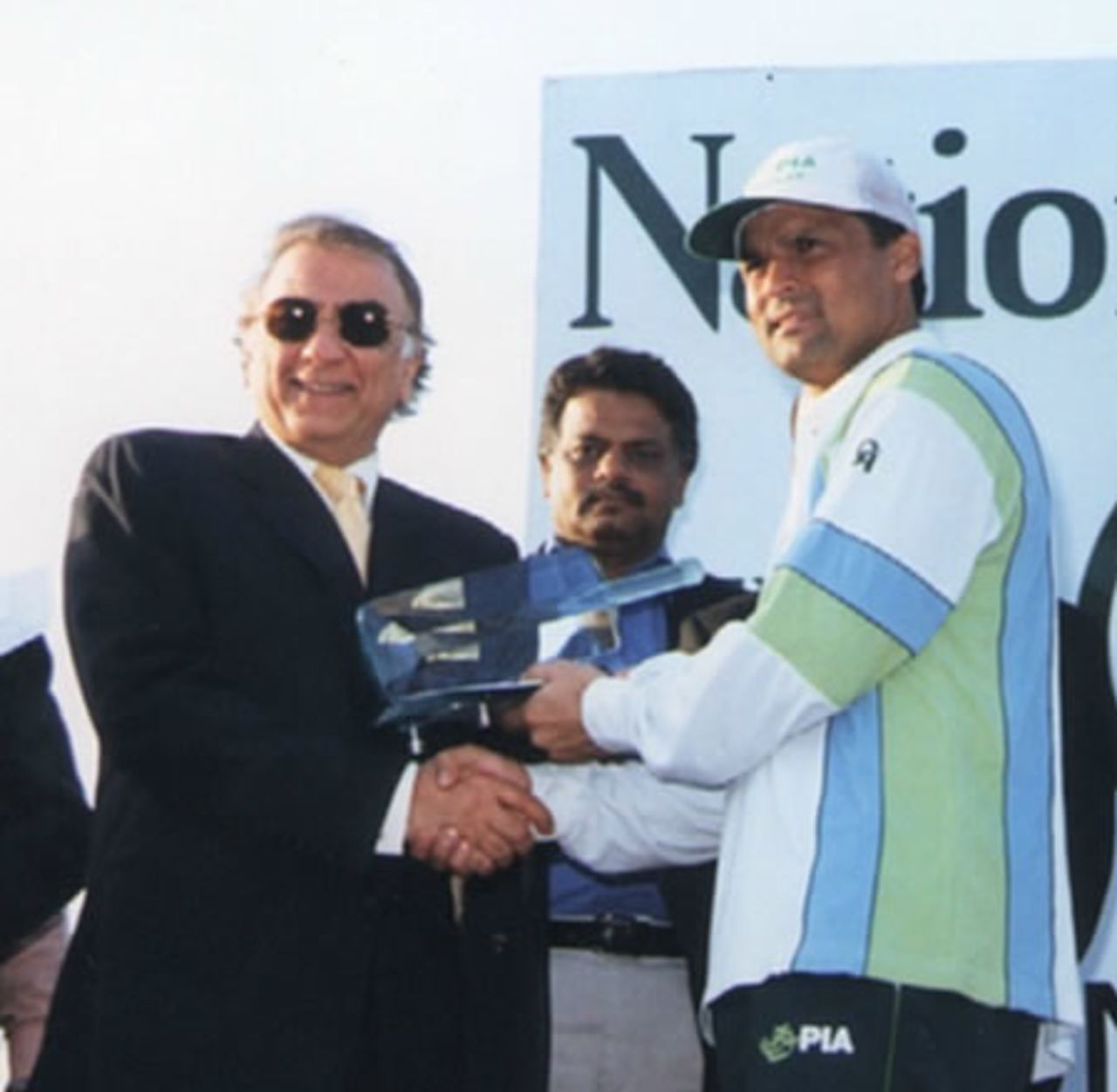 PIA skipper Moin Khan receiving the cup, NBP Patron's Cup final, Gaddafi Stadium, 31 March 2003