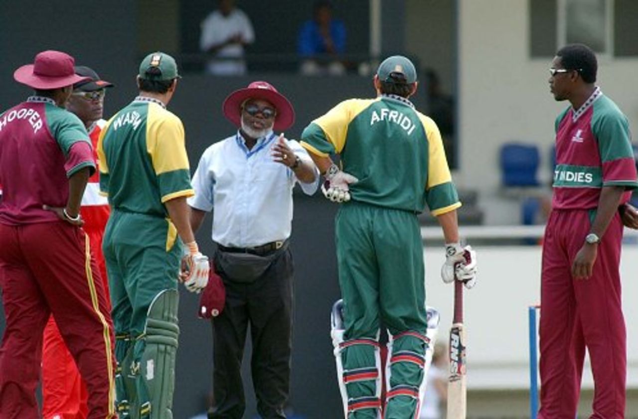 Umpire Clancy Mack of Antigua makes the decision to award points to West Indies after Shahid Afridi is unable to continue due to a strained back, Double Wicket World Championship, 4-6 April 2003 (courtesy St.Lucia Tourist Board)