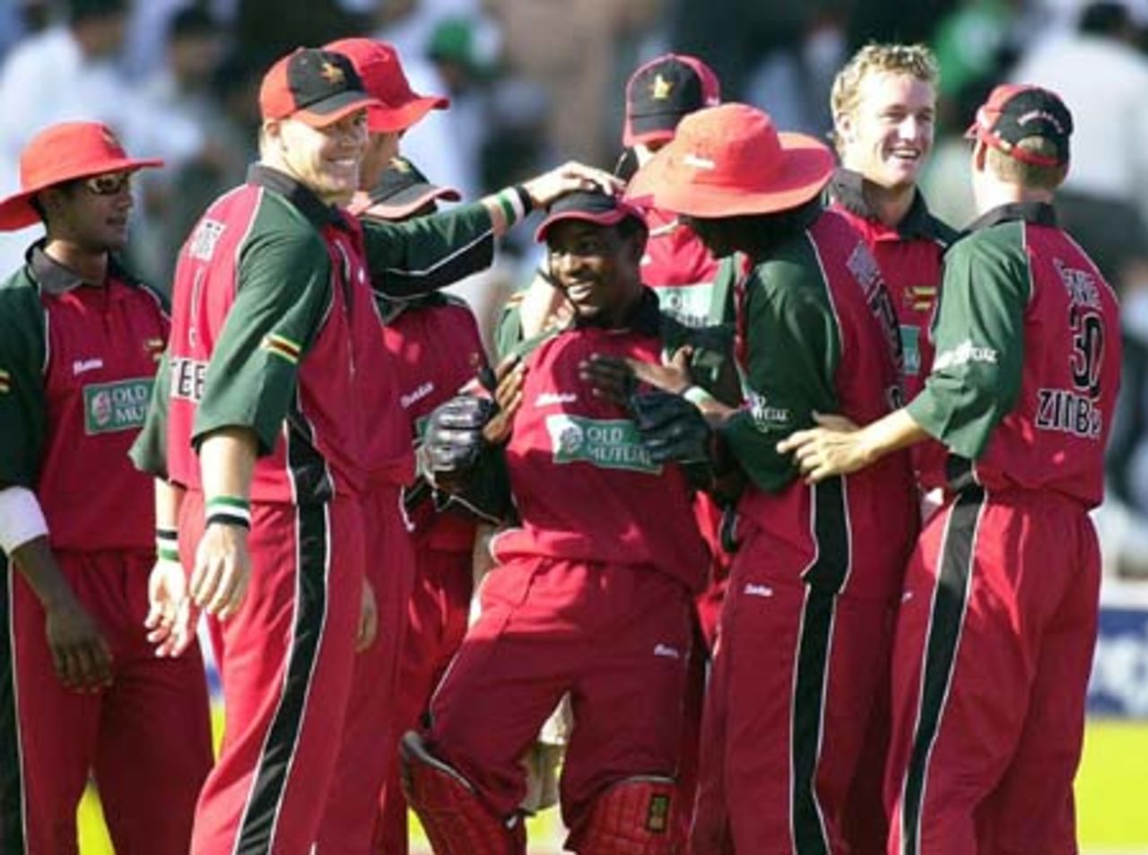Zimbabwe team celebrate the dismissal of Pakistani middle order batsman Younis Khan during the first one day international match of the four nations Sharjah Cricket tournament, 03 April 2003.