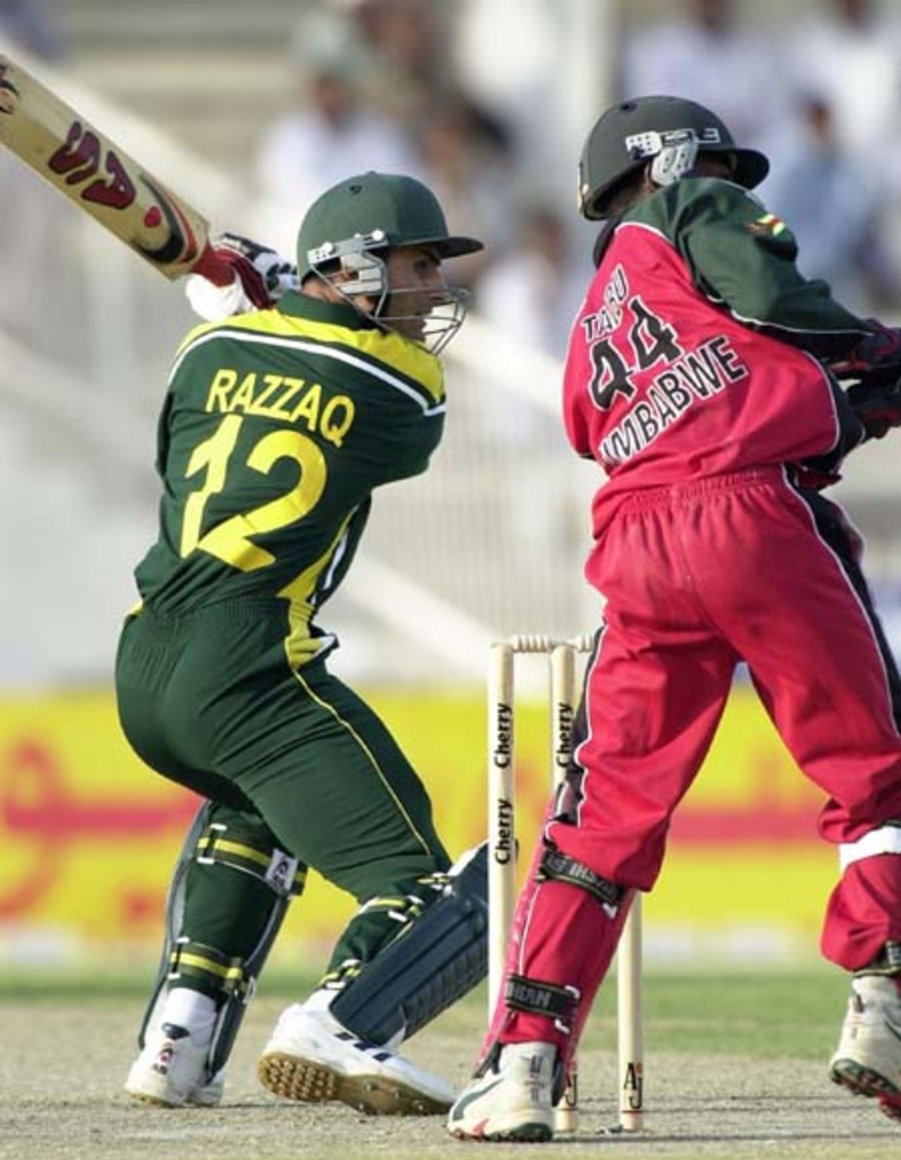 Pakistani all-rounder Abdul Razzaq (L) plays during his 76 runs inning in the first one day match against Zimbabwe in Sharjah, 03 April 2003.