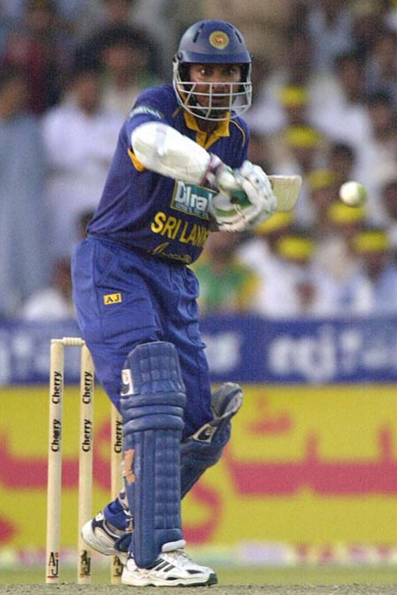 Sri Lankan middle order batsman and the highest scorer Kumar Sangakkara keeps eyes on the ball during  the 2nd one day match against Pakistan in Four Nation Sharjah Cricket Tournament, 04 April 2003.