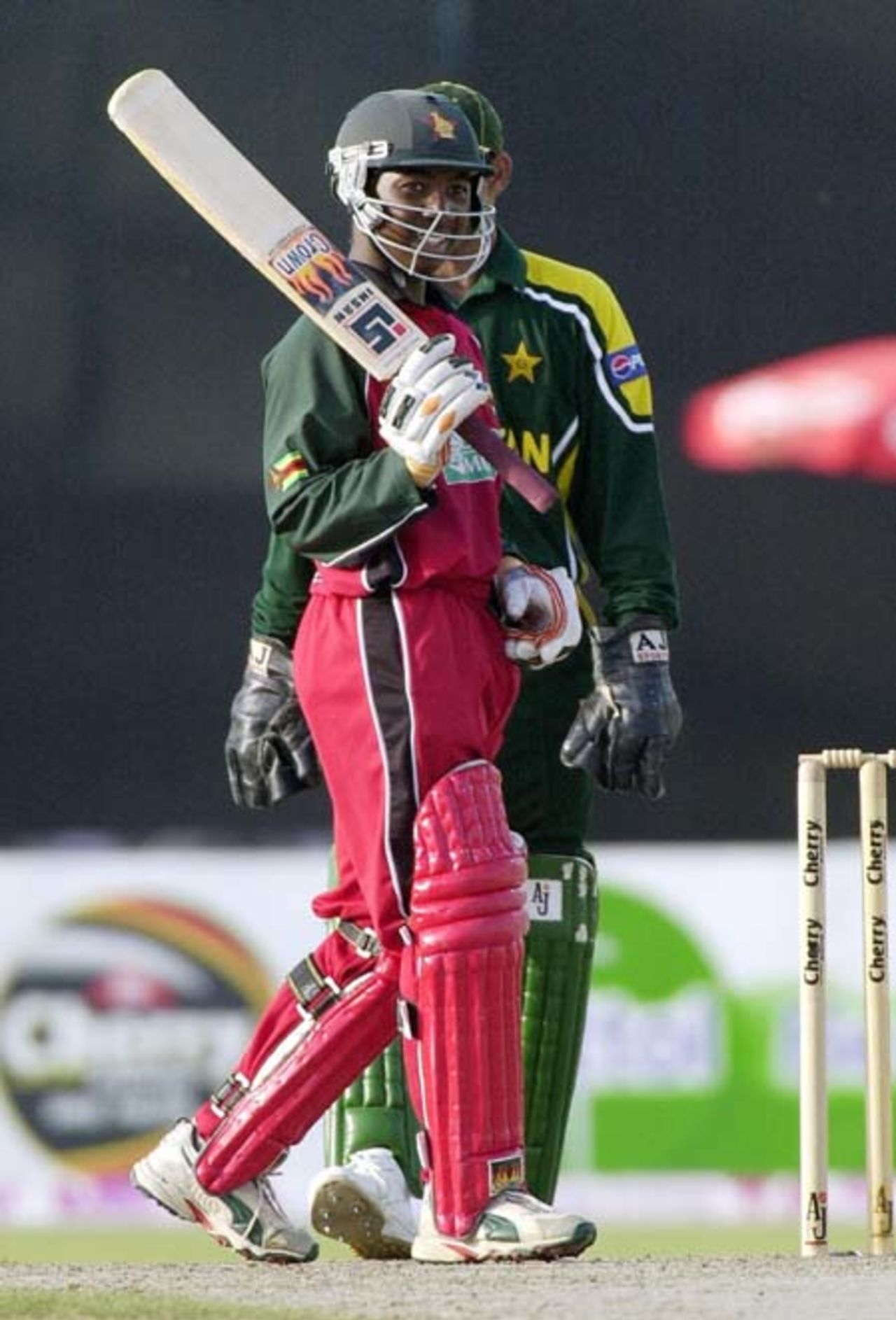Zimbabwe's top scorer Tatenda Taibu acknowledges the crowd after a brilliant half century against Pakistan during the final match of the Four Nation Sharjah Cricket Tournament, 10 April 2003.