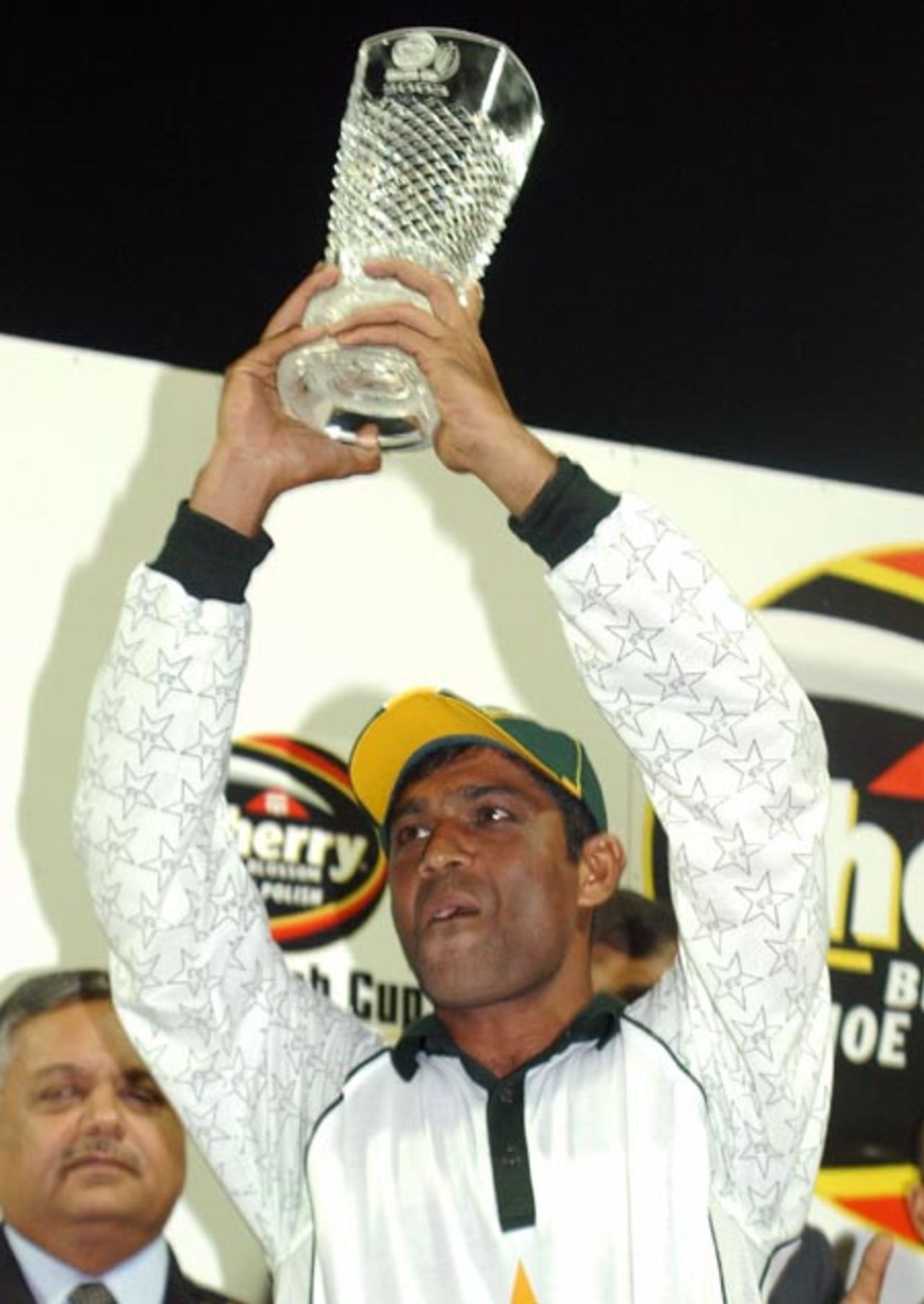 Pakistani Cricket team captain Rashid Latif lifts the Sharjah Cup 2003 after winning the final against Zimbabwe in the Four Nation Sharjah Cricket Tournament, 10 April 2003.