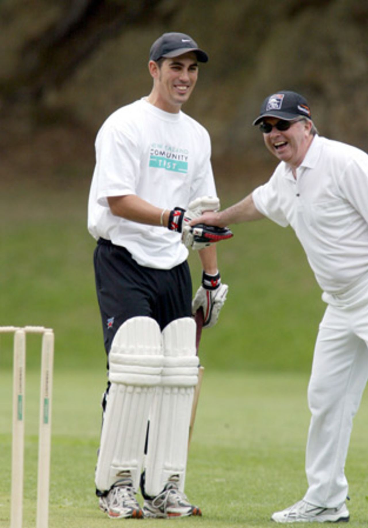New Zealand player Mathew Sinclair shakes the hand of Cabinet Minister Paul Swain during his innings. A New Zealand Cricket Invitational XI played a Parliamentary XI at Wellington College in Wellington to launch the New Zealand Community Trust's $250,000 sponsorship of the NZC secondary schools and club development programme. 13 April 2003.