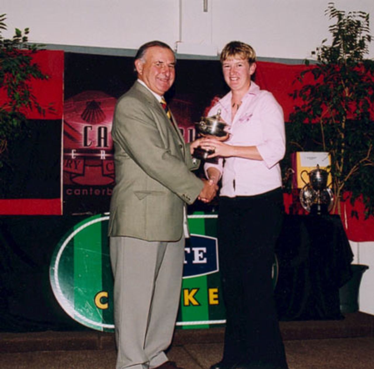 East Christchurch-Shirley bowler Helen Daly (right) receives the Felton Trophy for taking the most wickets in women's first grade from Canterbury Cricket Association president Brian Adams. Canterbury Cricket Association Awards 2002/03 at the Canterbury Horticultural Society Hall at Christchurch, 10 April 2003.