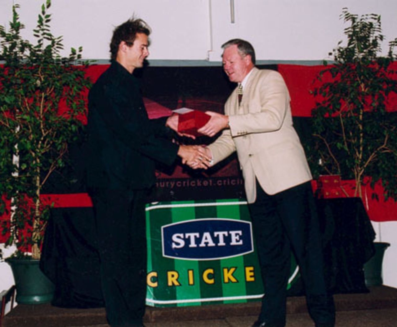 Chris Martin (left) receives the Holiday Inn State Canterbury Wizard Bowler of the Year award from Brian Tinworth of Holiday Inn. Canterbury Cricket Association Awards 2002/03 at the Canterbury Horticultural Society Hall at Christchurch, 10 April 2003.