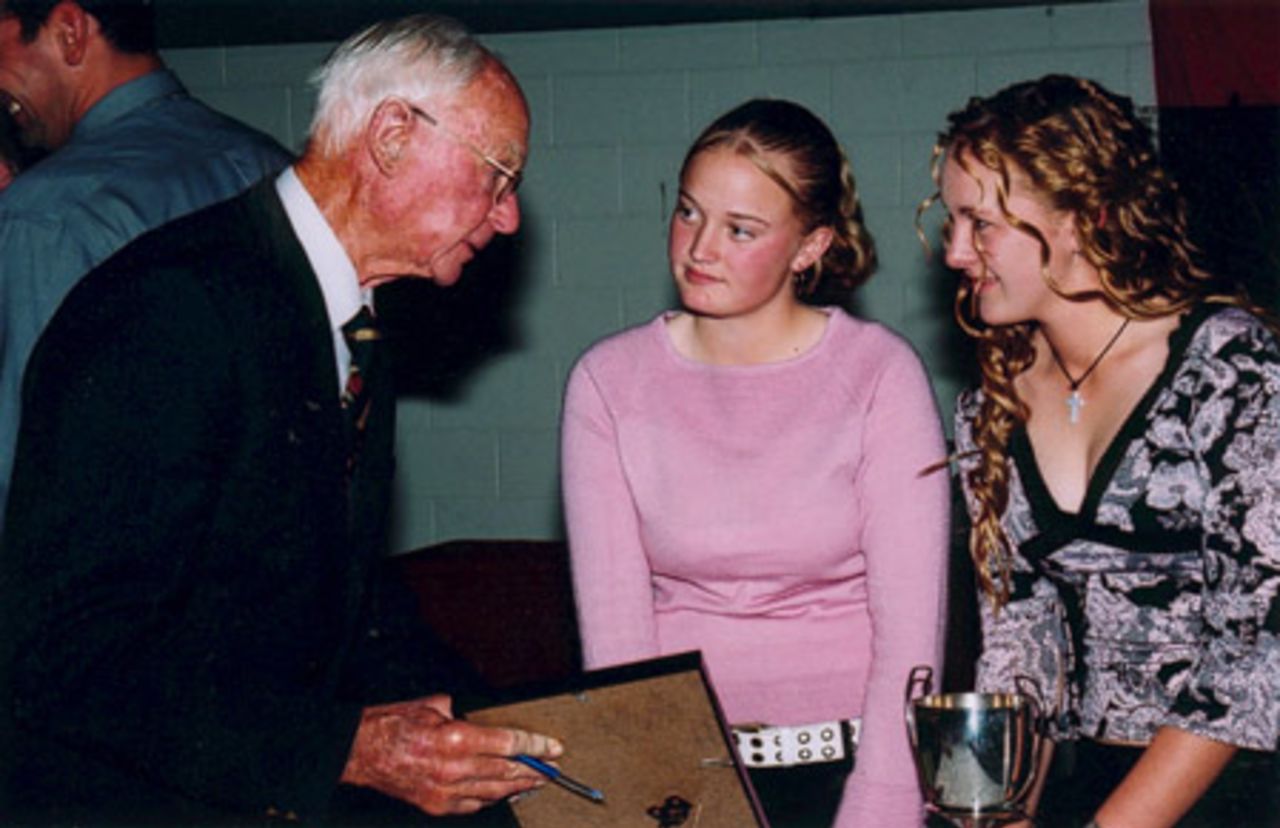 Former New Zealand captain and Canterbury player Walter Hadlee (left) chats with members of the winning St Albans third grade women's team after they received their trophy. Canterbury Cricket Association Awards 2002/03 at the Canterbury Horticultural Society Hall at Christchurch, 10 April 2003.