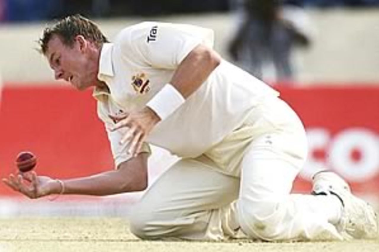 PORT OF SPAIN - APRIL 22: Brett Lee of Australia drops a return catch off his bowling from Brian Lara of the West Indies during day four of the Second Test between the West Indies and Australia played at Queens Park Oval on April 22, 2003 in Port of Spain, Trinidad.