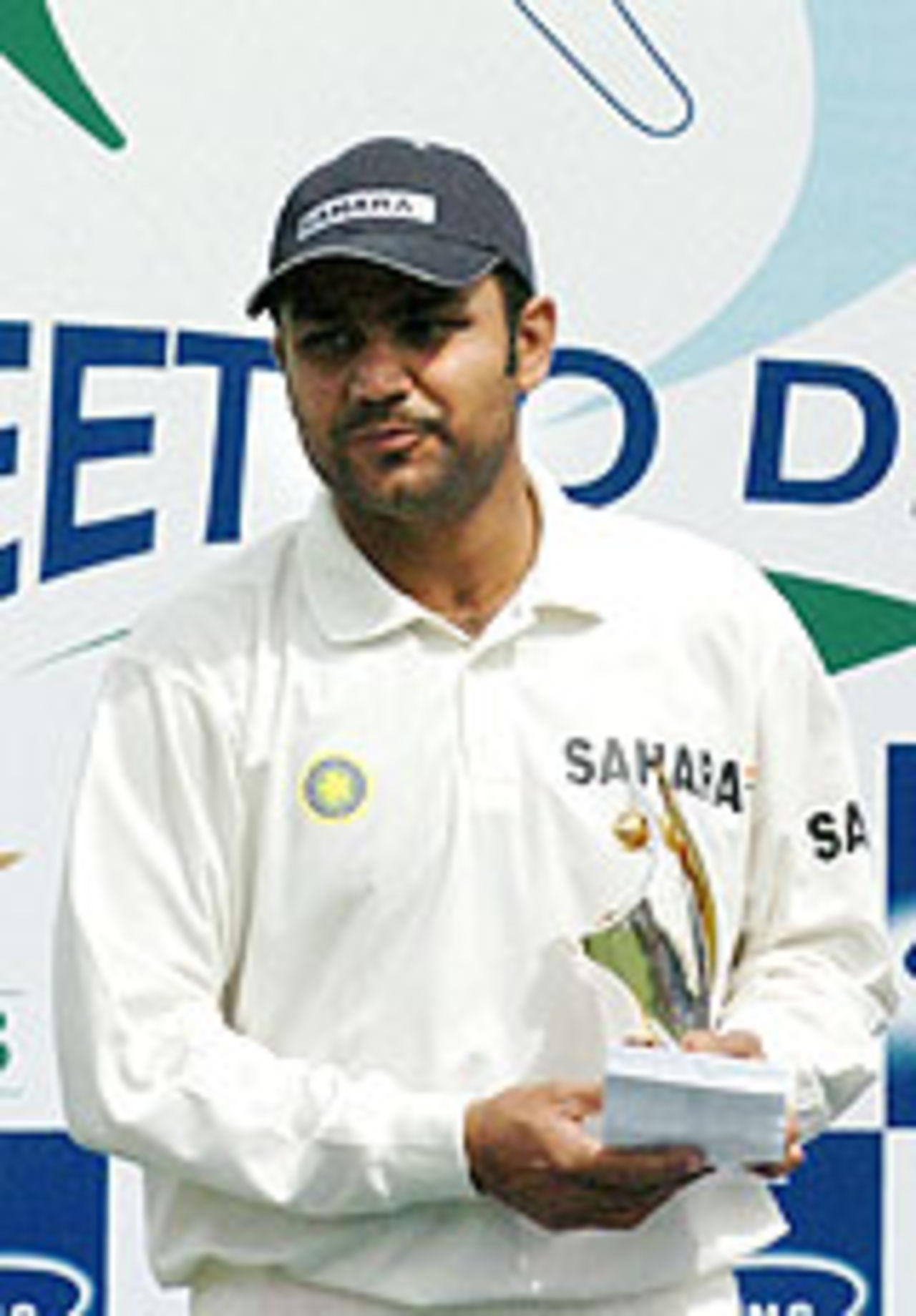 Virender Sehwag holds up his award, Pakistan v India, 1st Test, Multan, 5th day, April 1, 2004