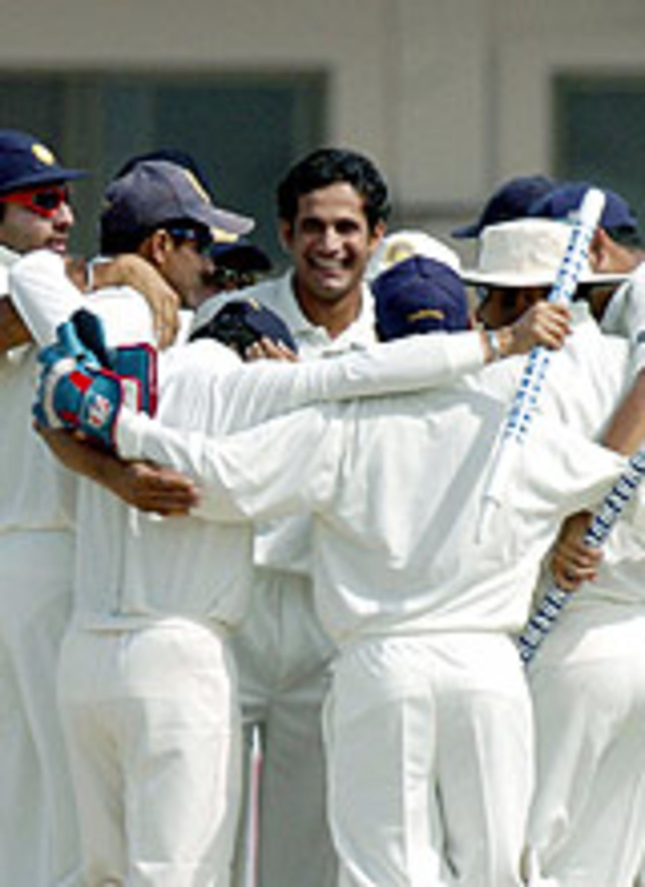 The Indian team huddle after the fall of the last wicket, Pakistan v India, 1st Test, Multan, 5th day, April 1, 2004