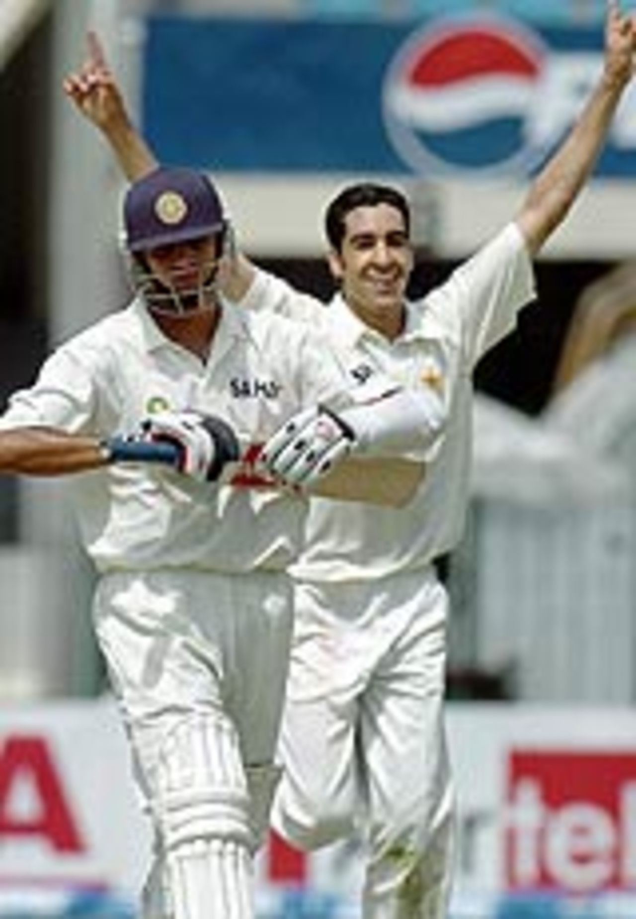 Rahul Dravid walks back as Umar Gul celebrates, Pakistan v India, 2nd Test, Lahore, 1st day, April 5, 2004