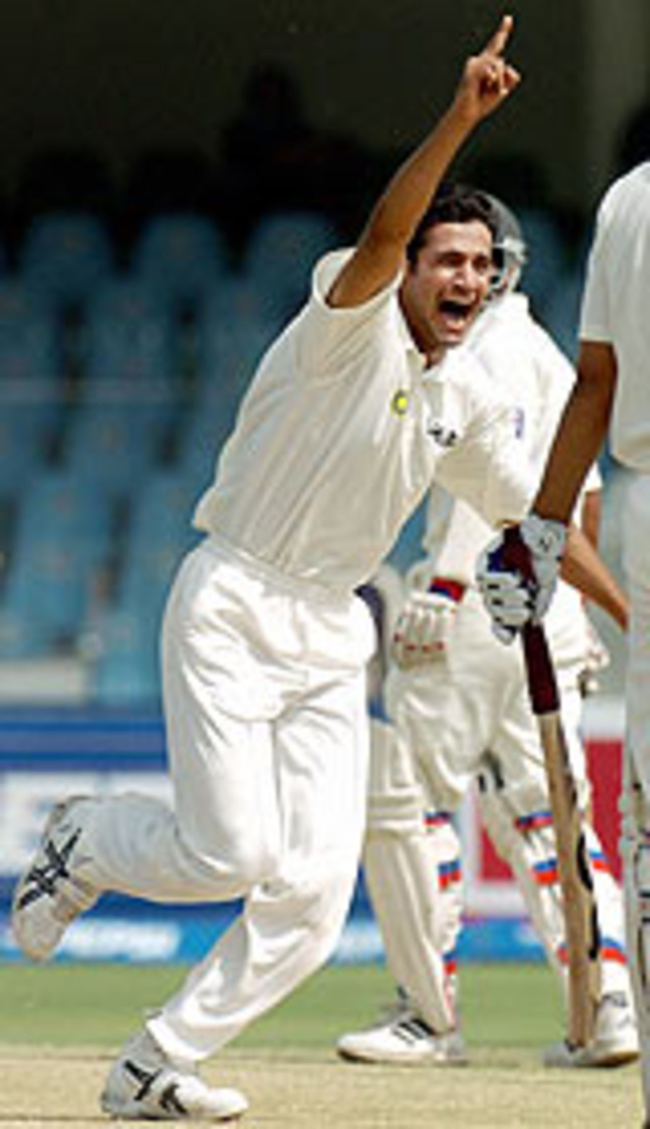 Irfan Pathan raises his finger after getting his man, Pakistan v India, 2nd Test, Lahore, 3rd day, April 7, 2004