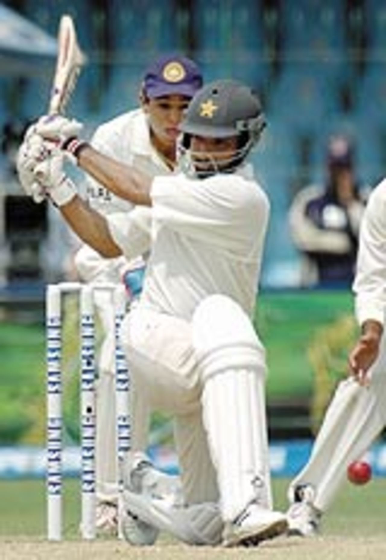 Asim Kamal sweeps on his way to a fine 73, Pakistan v India, 2nd Test, Lahore, 3rd day, April 7, 2004