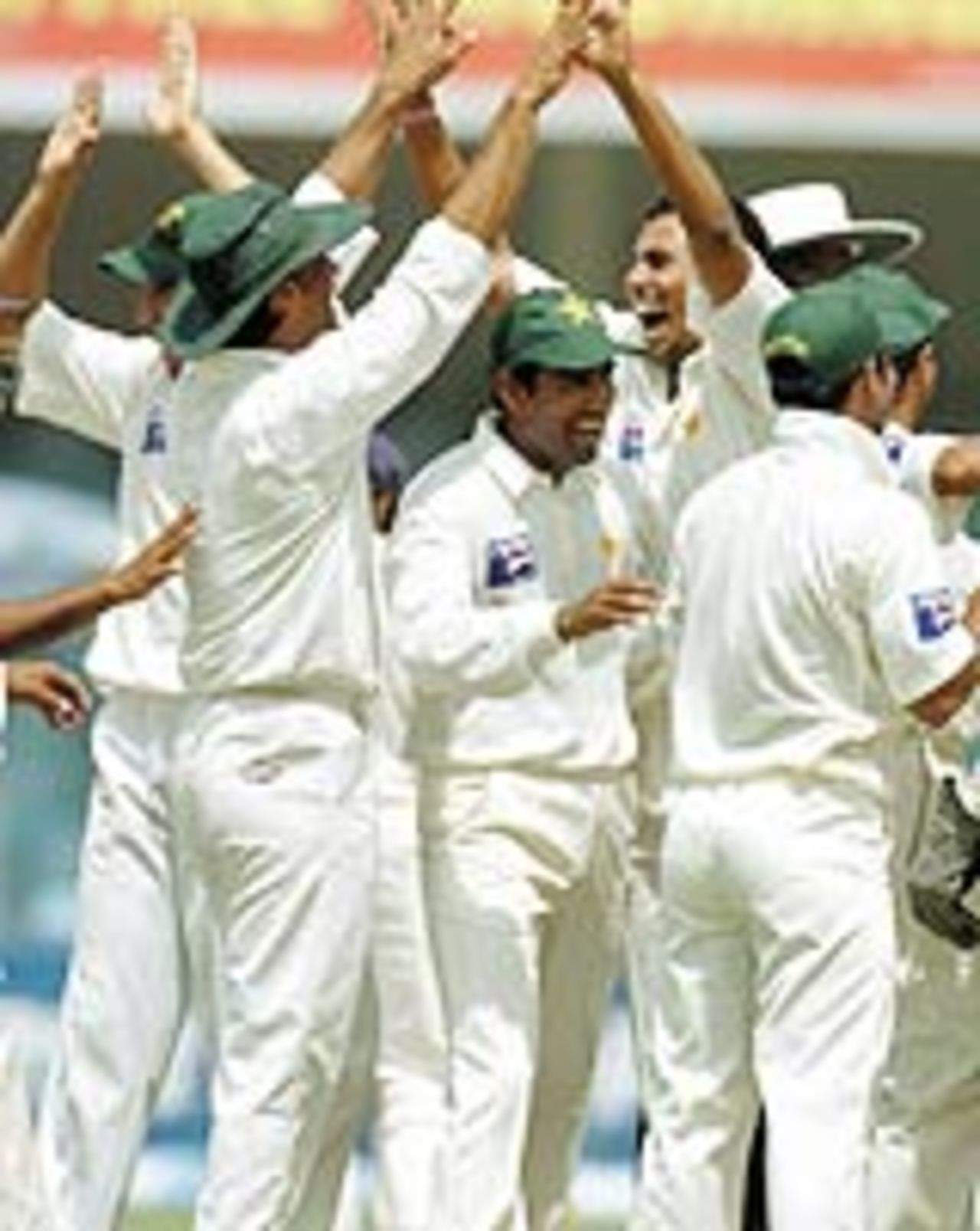 Pakistan players celebrate Anil Kumble's dismissal, Pakistan v India, 2nd Test, Lahore, 4th day, April 8, 2004