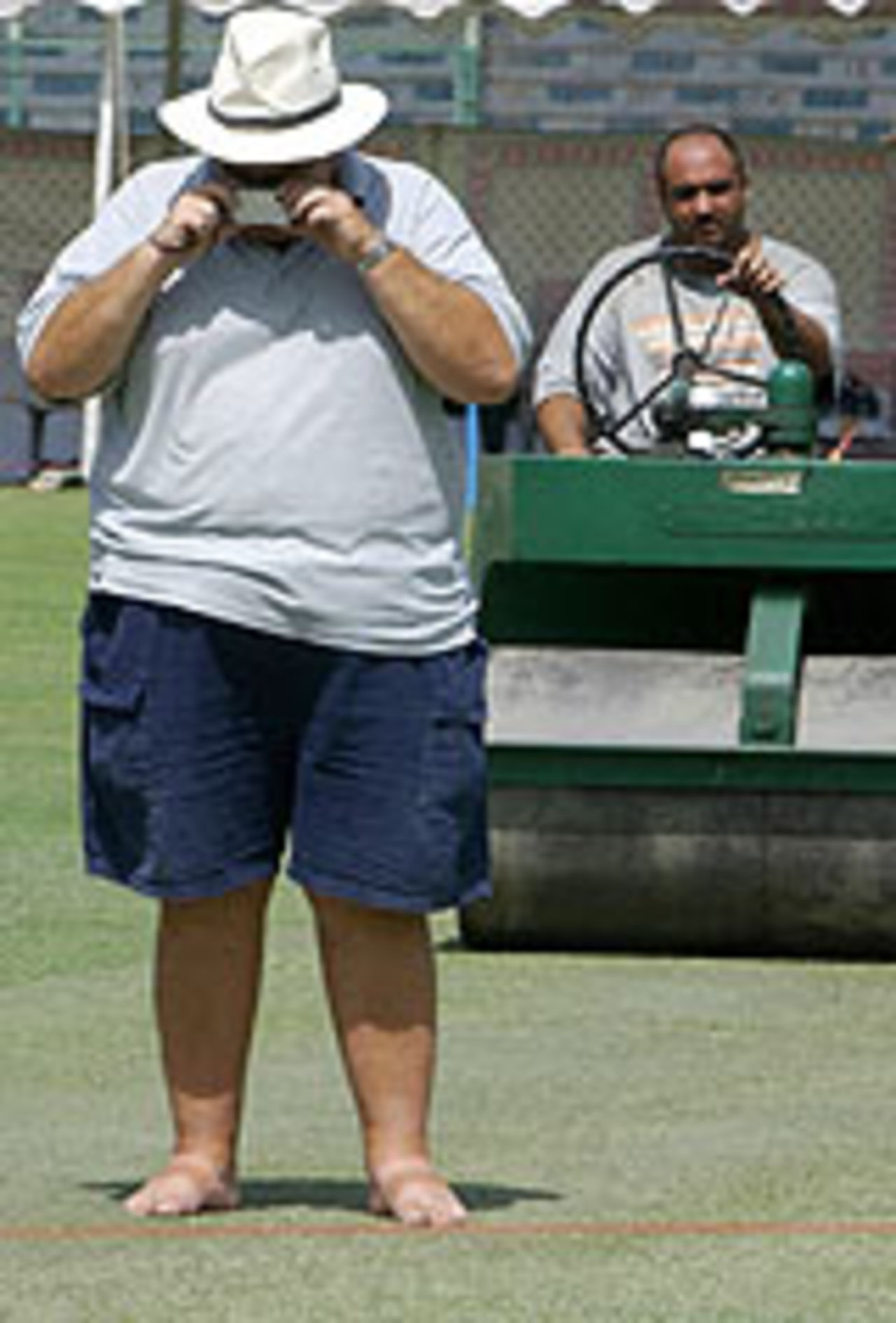 Andy Atkinson takes a snapshot of the pitch | ESPNcricinfo.com