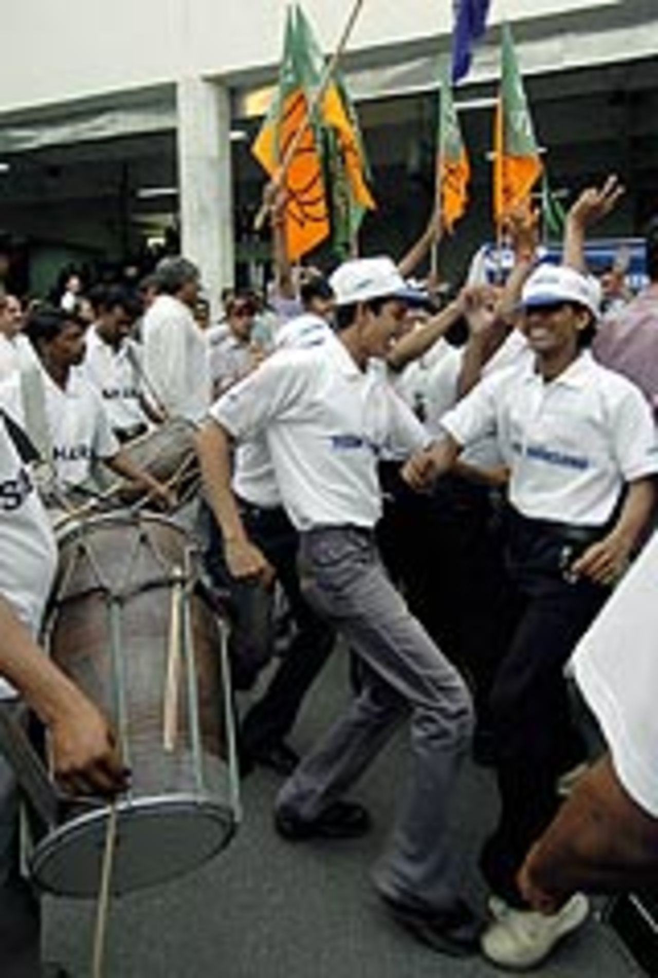 Indian supporters celebrate at the Indira Gandhi Airport in New Delhi, April 17, 2004