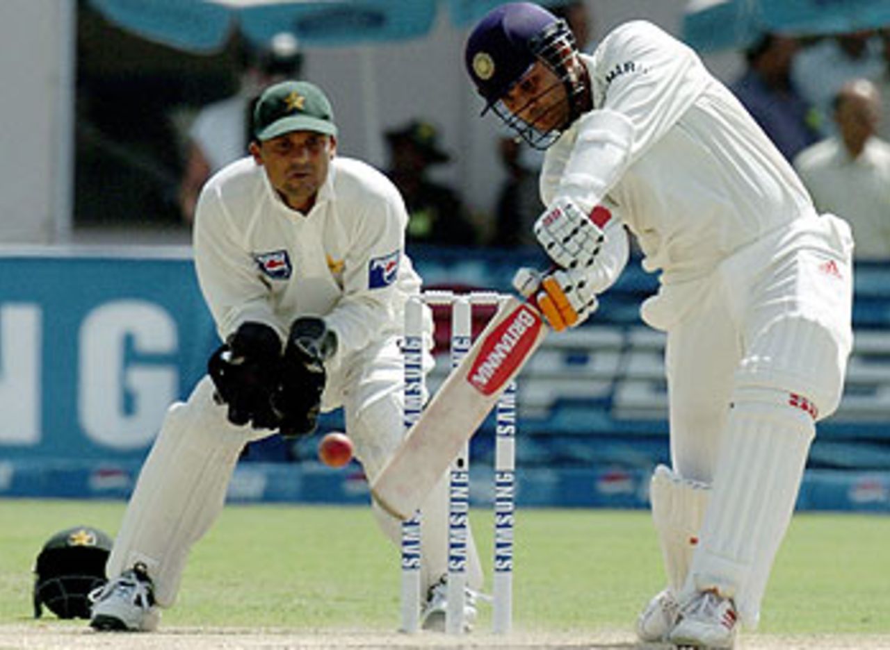 Take that! Virender Sehwag gives the ball an almighty tonk as he races to 228 by the end of the first day, Pakistan v India, 1st Test, Multan, 1st day, March 28, 2004