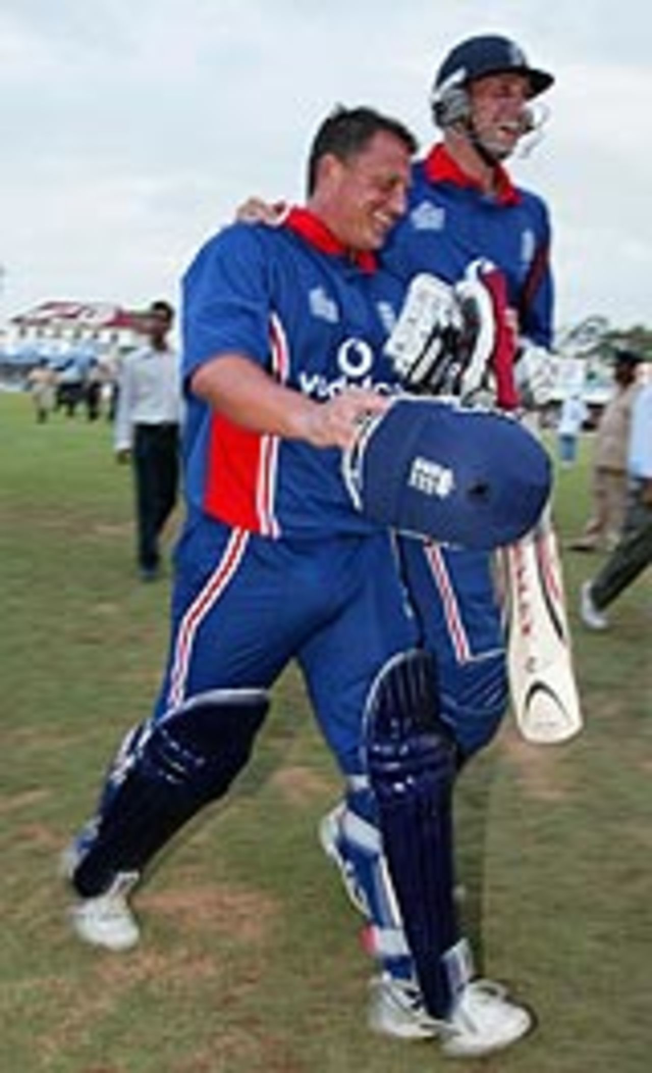 Darren Gough and Stephen Harmison leave the field after England's thrilling two-wicket win