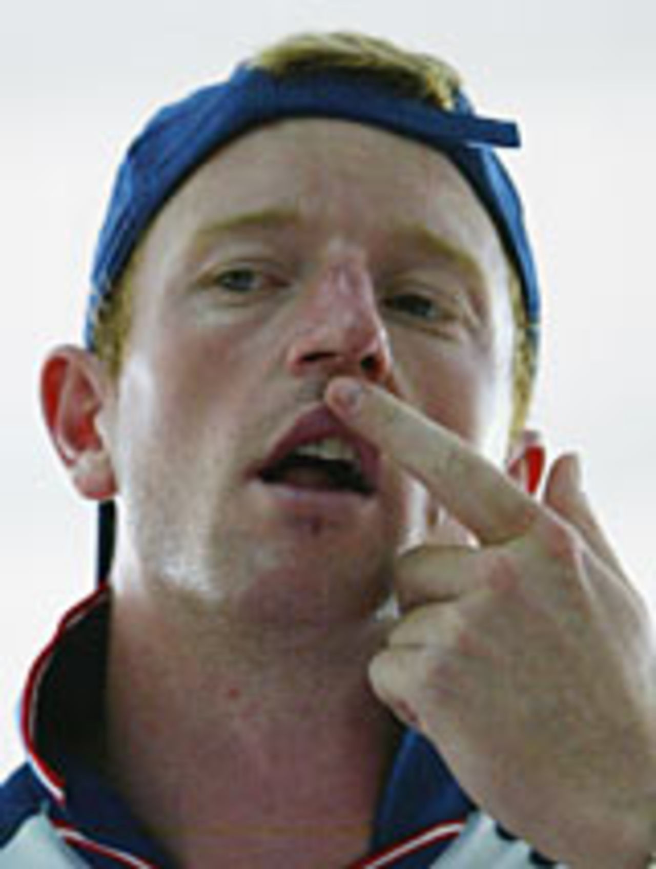 Paul Collingwood shows where he broke his nose after running in to the post while playing basketball , Grenada, April 27, 2004