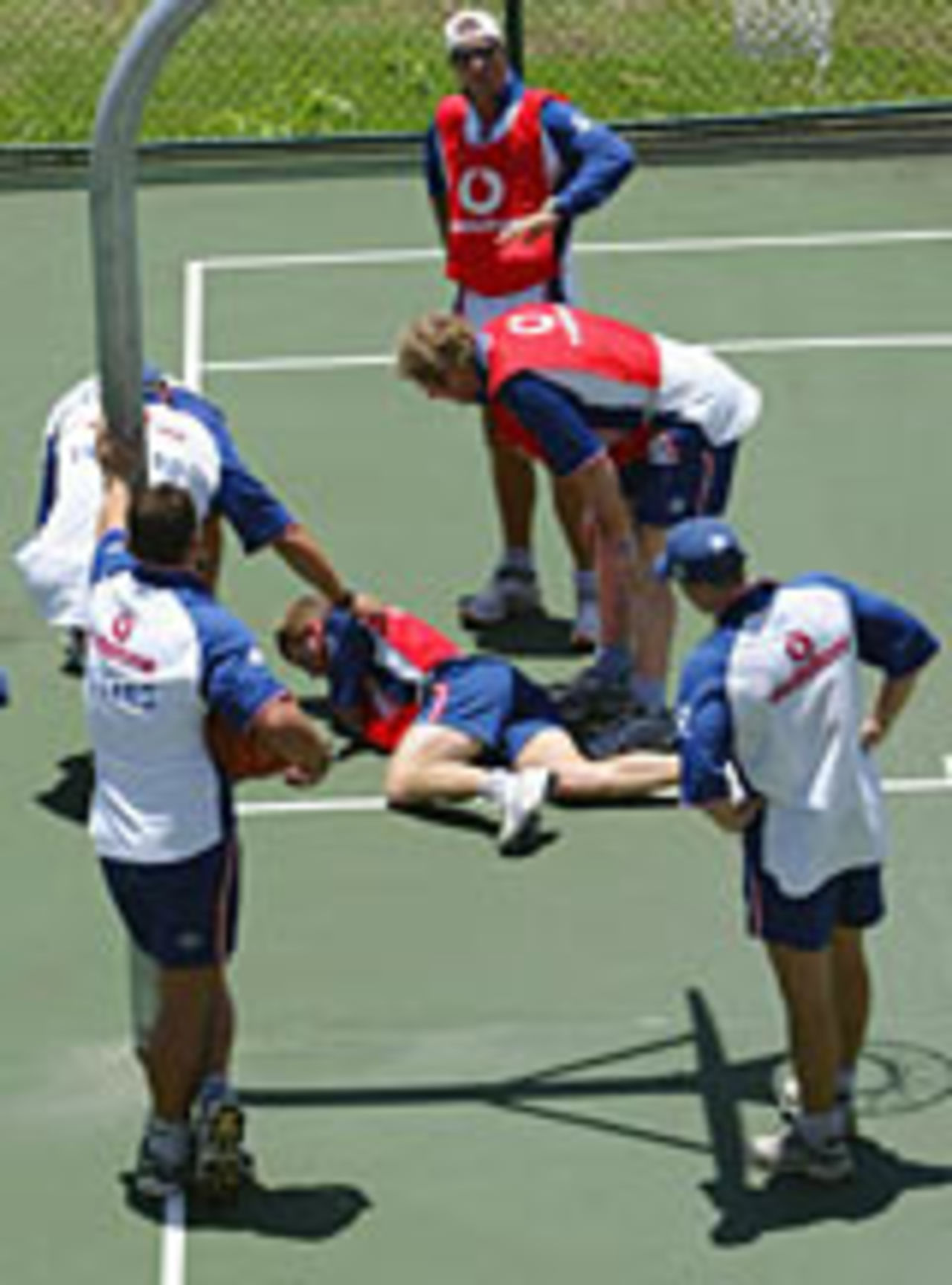 Paul Collingwood lies on the floor after breaking his nose after running into a post while playing basketball, Grenada, April 27, 2004