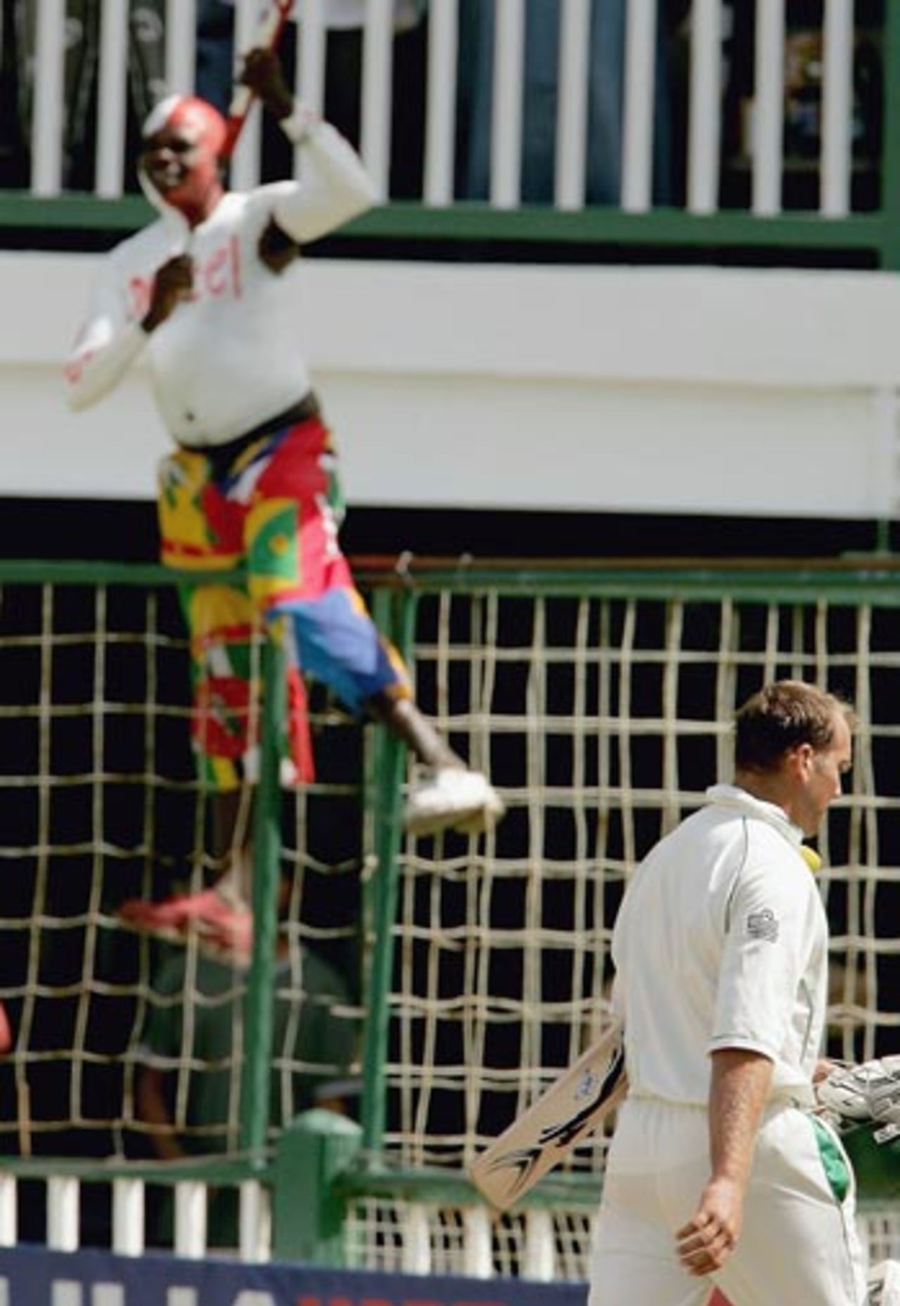 Jacques Kallis trudges back, and it's celebration time for a West Indian fan, West Indies v South Africa, 1st Test, Guyana, April 2, 2005